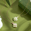 Sterling silver necklace with magnolia shaped Hetian jade pendant on green background