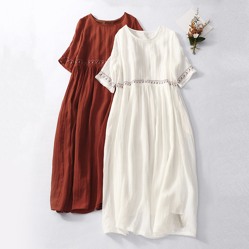 White and red embroidered cotton linen midi dresses with short sleeves laid flat