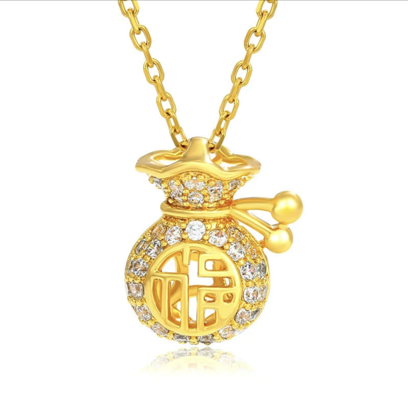 Close up of gold tone money bag pendant with Fu character on a white background
