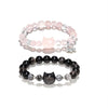 Two beaded bracelets with cat charms, one pink and one black