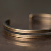 Matte Brass Cuff Bracelet with Textured Rope Knot Design