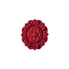 Close-up of a red handmade lotus pendant with intricate carvings