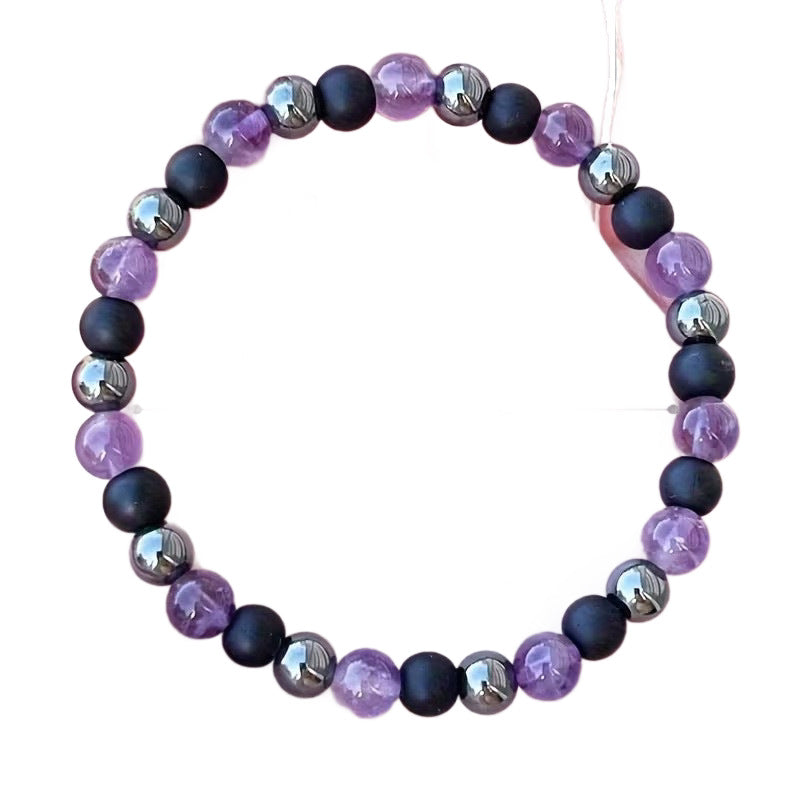 Beaded bracelet with alternating purple and black round stones on a white background