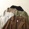 Flat lay of five solid color linen jackets showing lapel collars and fabric texture