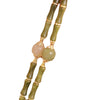 Close up of green bamboo shaped jade beads on a wrist