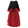 Front view of a black and red color block long sleeve midi dress