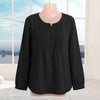 Black cotton linen long sleeve shirt with pleated chest detail on a mannequin