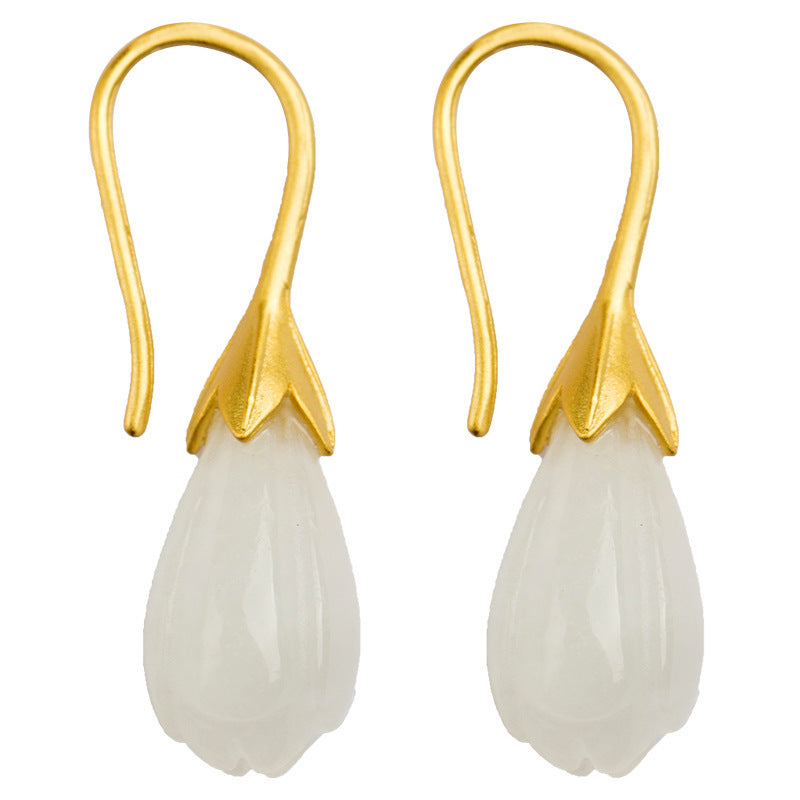 Pair of gold-tone drop earrings with white magnolia-shaped stones