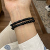 Black bamboo joint and round bead stretch bracelet on wrist