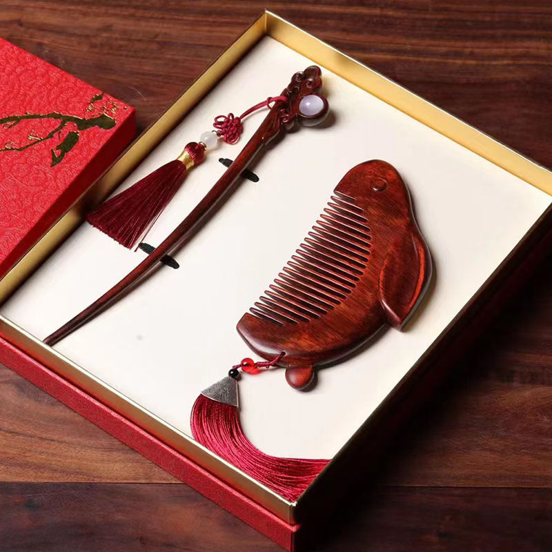 Red sandalwood rabbit comb and hairpin set inside a red gift box
