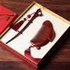 Red sandalwood rabbit comb and hairpin set inside a red gift box
