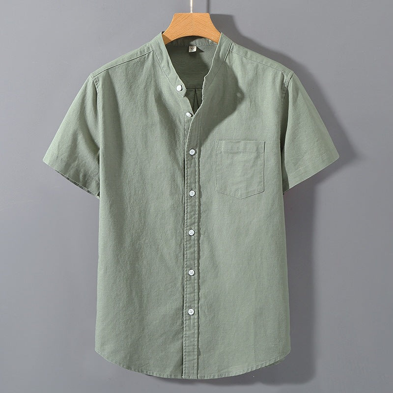 Front view of a light green men's short sleeve linen shirt on a hanger