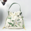 Embroidered Drawstring Bucket Bag with Tassel, Floral and Animal Motifs