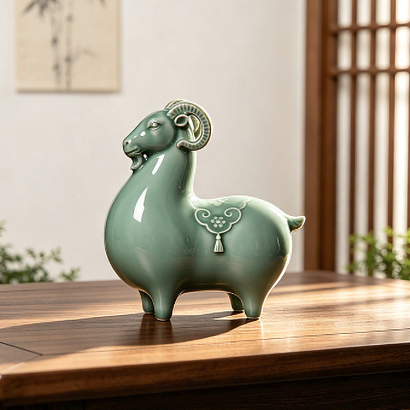 A green ceramic goat figurine sitting on a wooden table