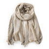 Beige viscose scarf with grey stripes and frayed edges displayed on white background