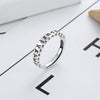 Silver-tone copper ring with Six True Words engraving on a white surface