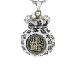 Close up of silver tone copper fortune bag pendant with rotating coin on a box chain