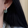 999 Silver and Green Stone Peace Buckle Earrings