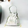 Embroidered Drawstring Bucket Bag with Tassel, Floral and Animal Motifs