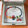 Hand-Woven Red String Bracelet with Sunflower and Fish Charms