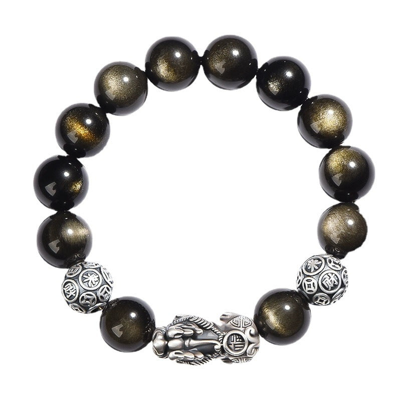 Close-up of a black obsidian beaded bracelet with a central silver Pixiu figure