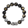 Close-up of a black obsidian beaded bracelet with a central silver Pixiu figure