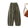 Front view of olive green loose fit linen cotton harem pants for women