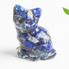 Close up of a blue lapis lazuli crystal chip resin cat figurine with gold flakes