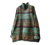 Green vintage floral knit sweater with a mock neck hanging on a wooden hanger