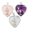 Silver heart pendant with rose vine on pink stone