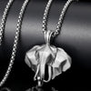 Close up view of a silver 3D elephant head pendant on a metal chain
