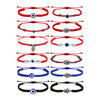 Collection of woven Evil Eye bracelets in red, blue, and black with various charms
