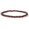 A single strand of small 4mm round stone beads on an elastic bracelet
