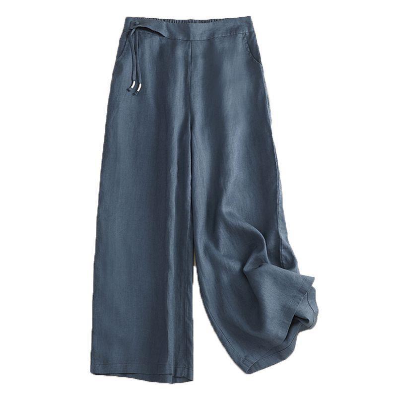 A pair of blue wide-leg cotton linen pants with a high waist and drawstring.