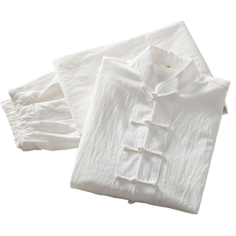 Folded white men's Tang suit set with long sleeve shirt and pants