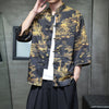 Man wearing a black three-quarter sleeve Tang suit shirt with gold dragon print