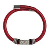 Close up of a wrist wearing a red woven bracelet with a silver mantra tube
