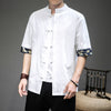 Man wearing a white linen Tang suit shirt with frog buttons and crane print cuffs