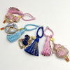 Assortment of colorful Song brocade keychains with tassels and gold-tone charms