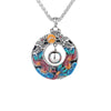 Round copper pendant with colorful enamel double dragons playing with a bead on a silver tone chain