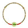 Close up of a multicolored woven rope bracelet with a light green jade donut charm