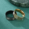 Two titanium steel rings with dragon carvings on a green background