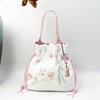 Embroidered Drawstring Bucket Bag with Tassel, Floral and Animal Motifs