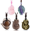 Collection of carved fox pendants in various colors including pink, purple, and brown on cords