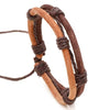 Close up of a brown and tan hand-woven leather bracelet on a white background