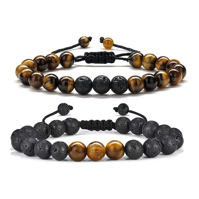 Two beaded bracelets featuring tiger eye and porous lava rock beads on black cords