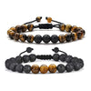 Two beaded bracelets featuring tiger eye and porous lava rock beads on black cords
