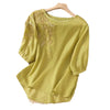 Yellow cotton linen women's shirt with floral embroidery on the shoulder