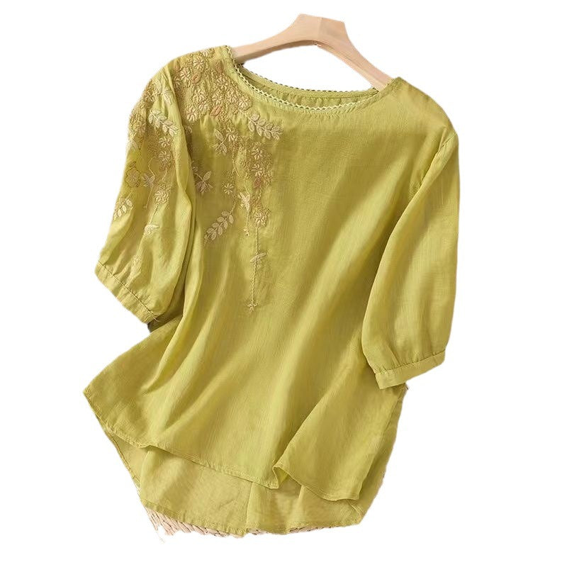 Yellow cotton linen women's shirt with floral embroidery on the shoulder