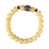 Close up of a cream colored bodhi seed bracelet with a silver charm